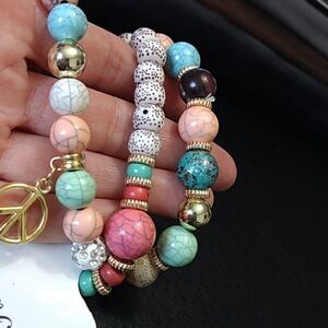 Beaded stretch bracelet trio with peace and star charms 7.25"